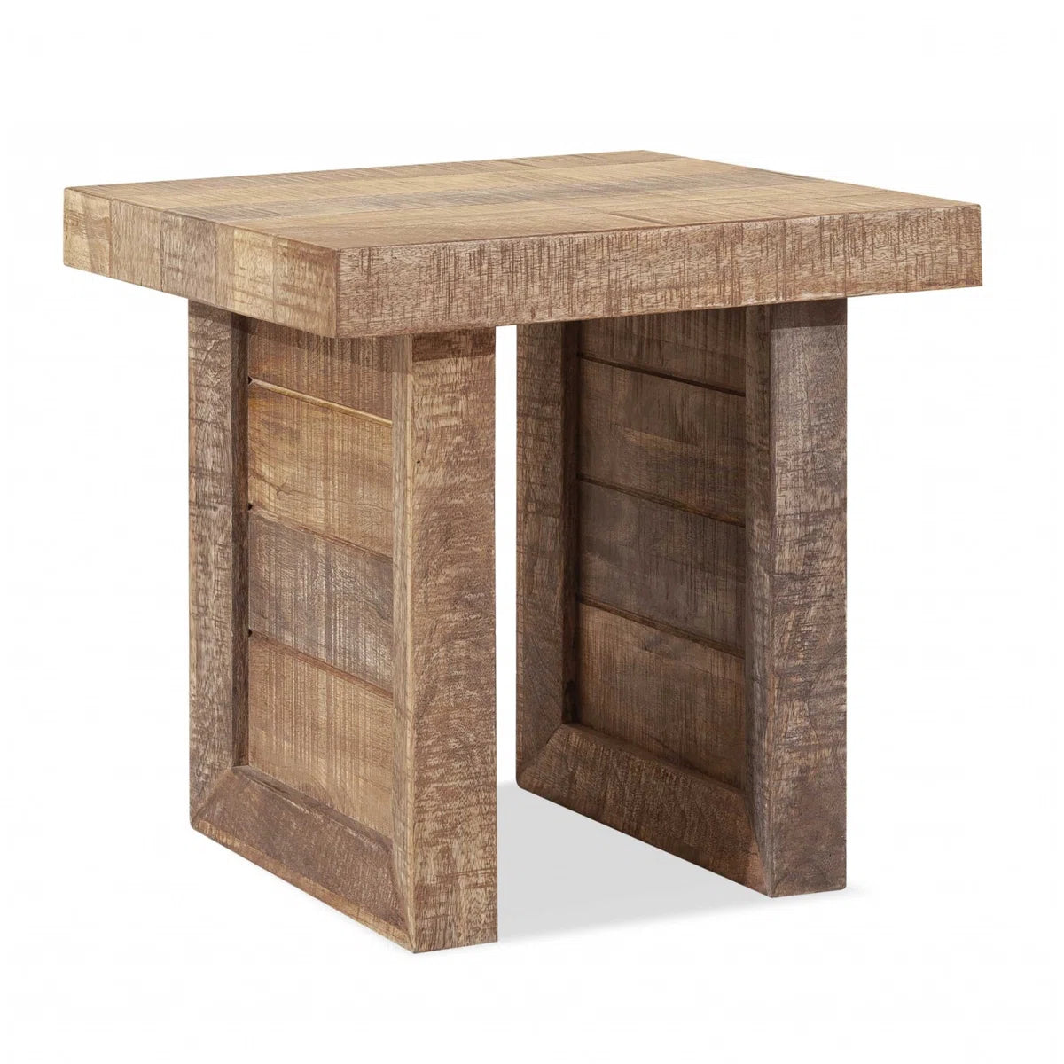 Solid wood butcher-block end table in a warm finish with chunky square legs beside a sofa.