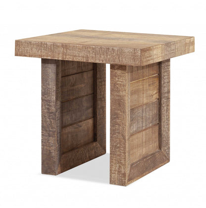 Solid wood butcher block-style end table in a warm finish with sturdy block legs (plain studio)
