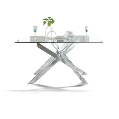 Modern glass dining table with metal base on a white background