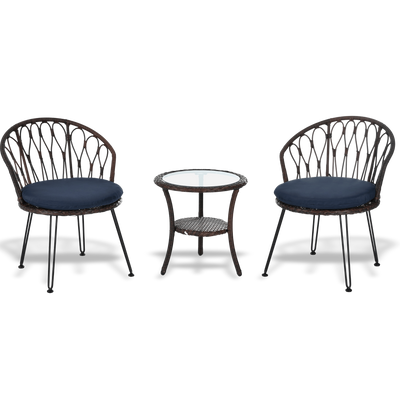 Two wicker chairs with navy cushions and a matching side table on a white background