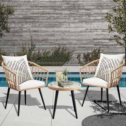 wicker patio bistro set detail, cushioned chairs by poolside