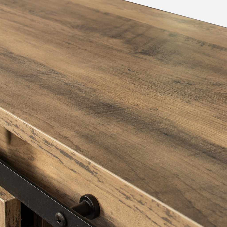 Walnut-finish rustic TV stand top with sliding barn door hardware and black metal accents.