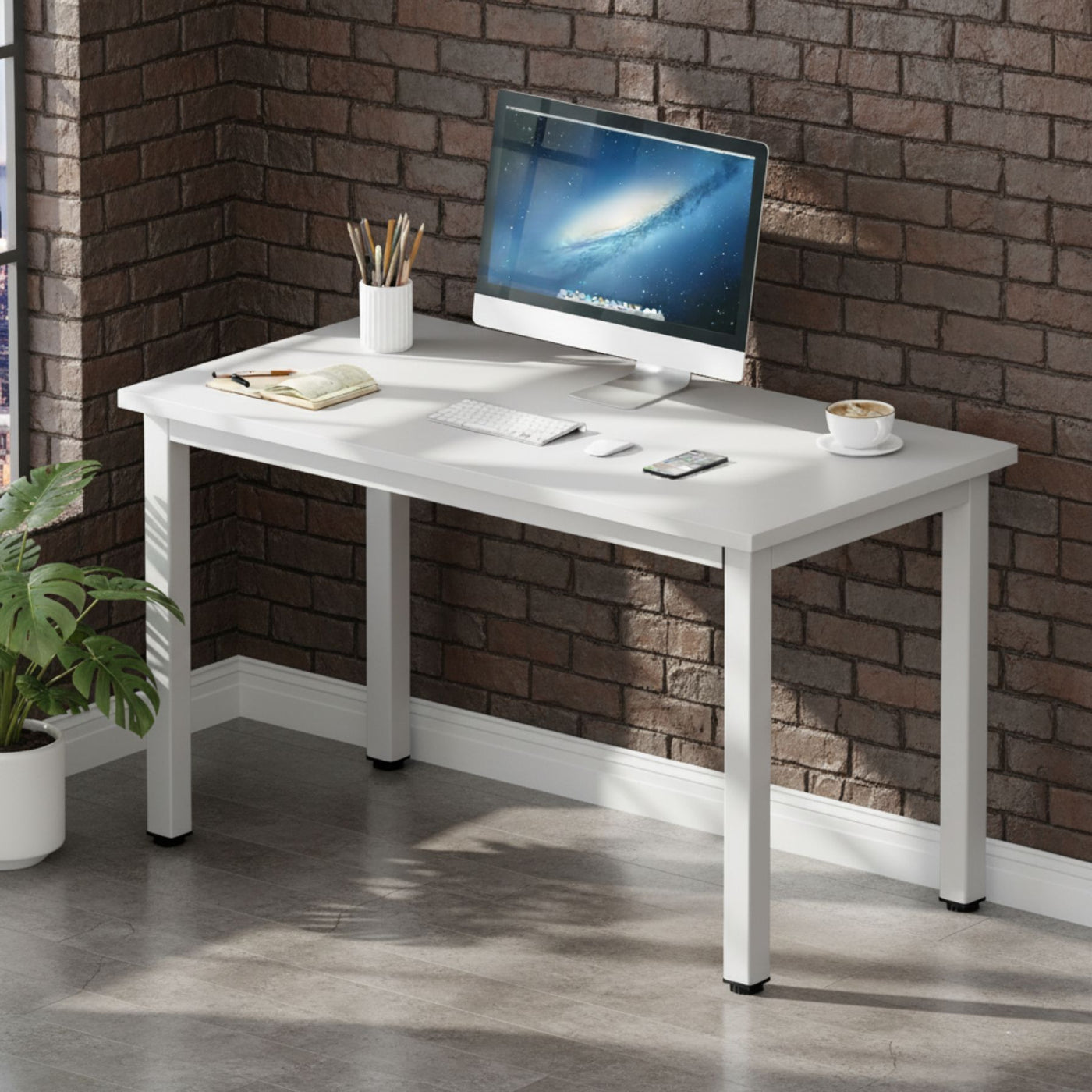 White desk with gray chair against a blue wall with a window view