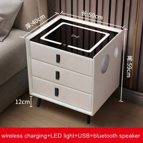 White three-drawer bedside table with wireless charging pad on top, USB ports and ambient LED night light.