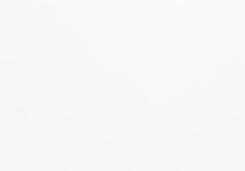 White wood grain desk surface.