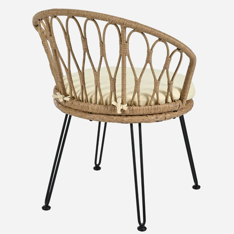 Wicker chair with a cushion on a white background