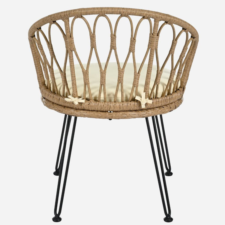 Wicker chair with black metal legs on a white background