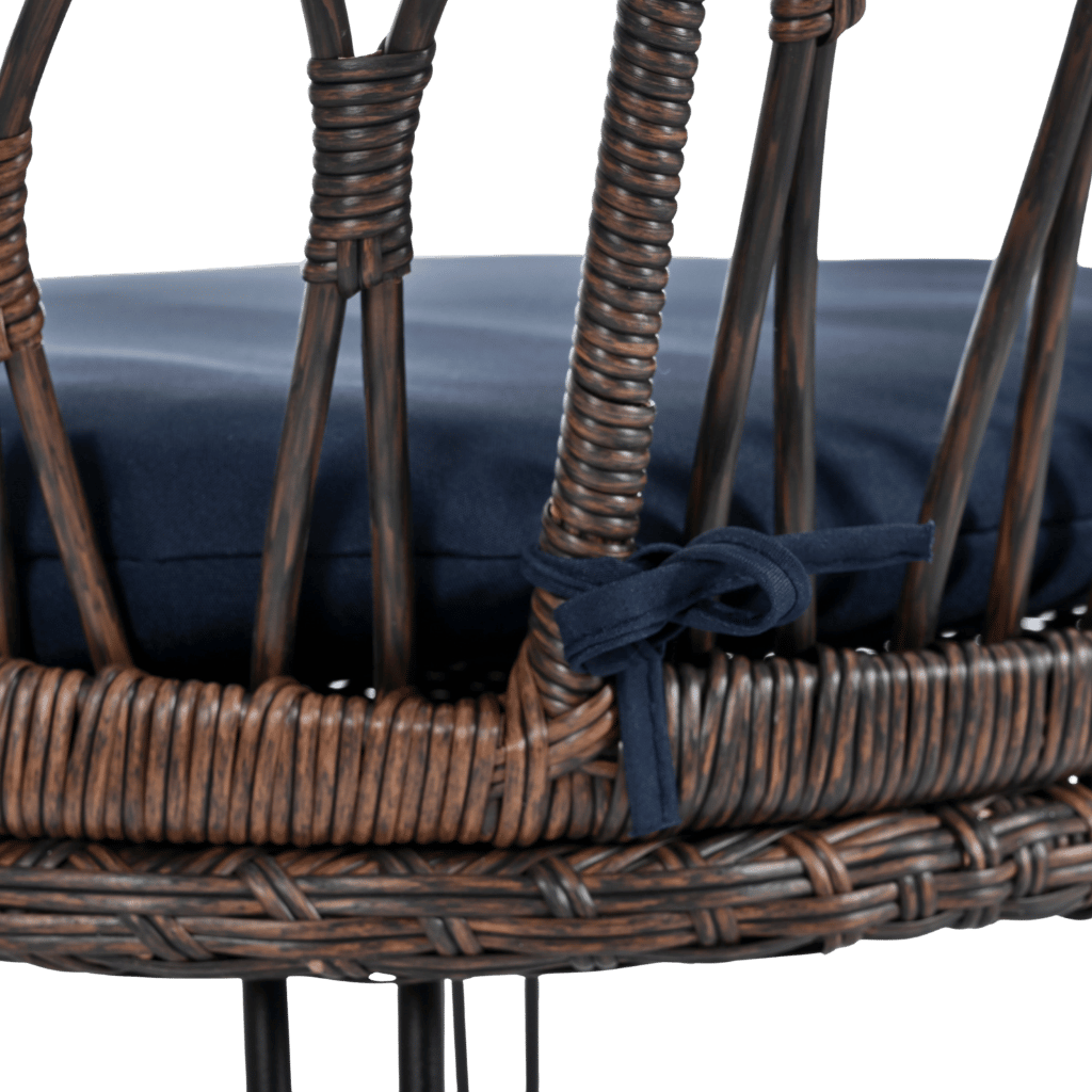 Wicker chair with navy cushion on a transparent background