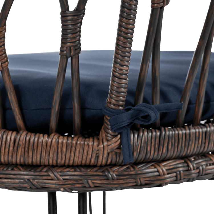 Wicker chair with navy cushion on a transparent background