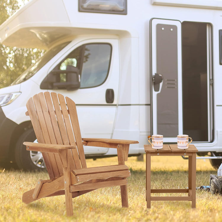 Wooden Adirondack chair and small table with two cups in front of a white RV.