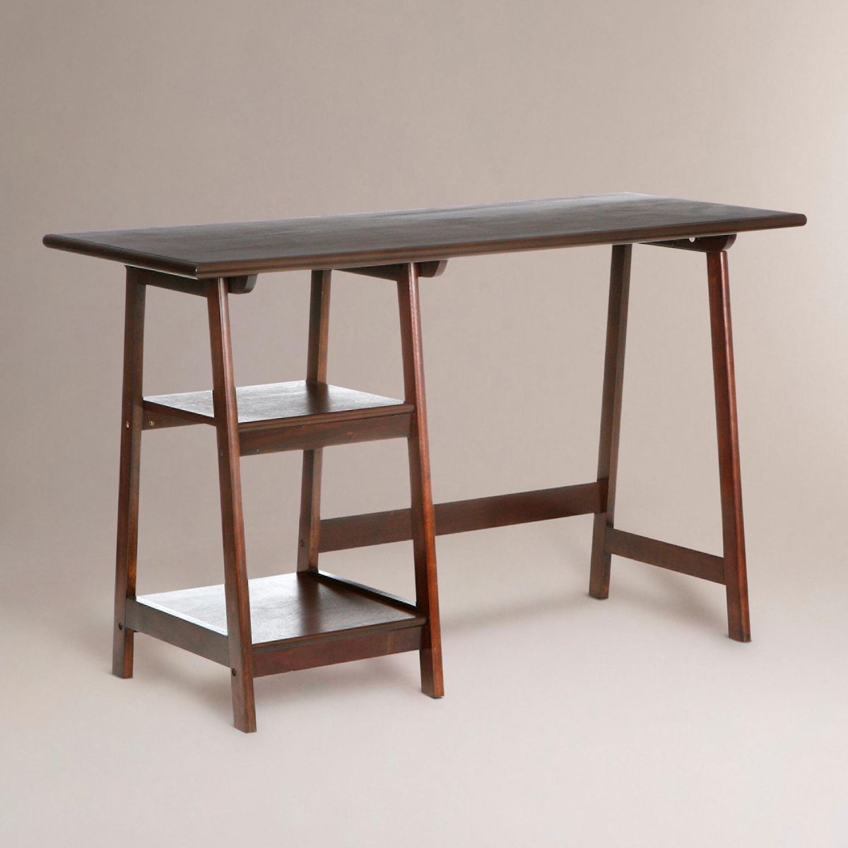 Wooden desk with a dark top on a plain background