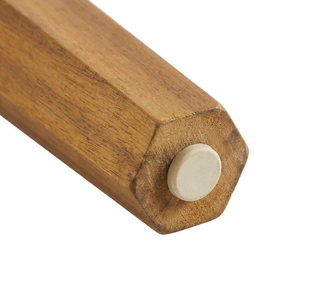 Foot cap detail on the acacia wood table leg, protecting the wood from ground contact
