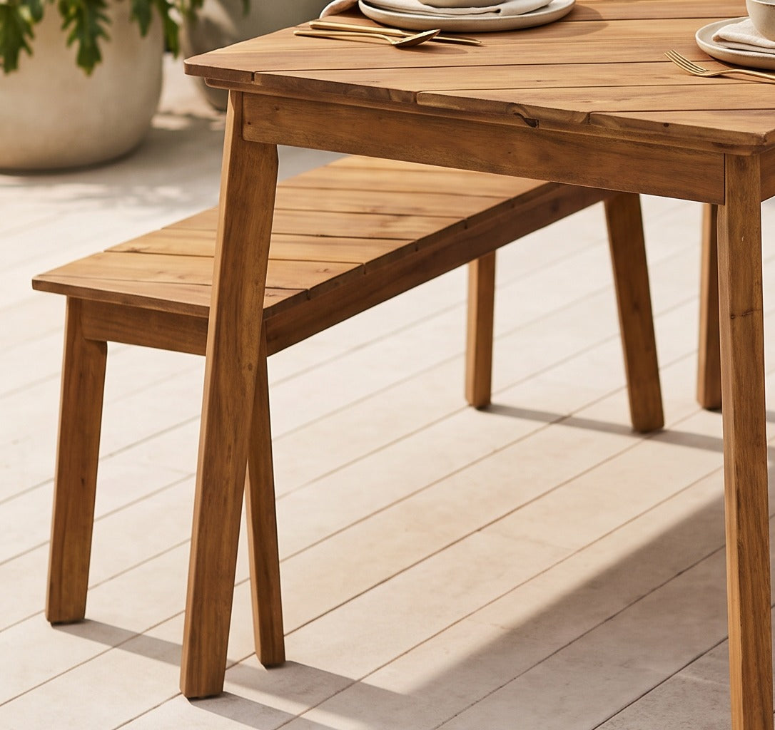 Environmental close-up of the acacia wood dining set in an outdoor patio setting
