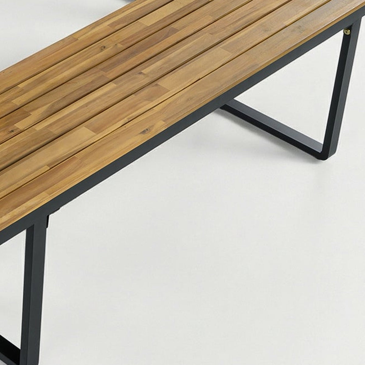 close-up of the acacia bench slats and black steel U-loop leg