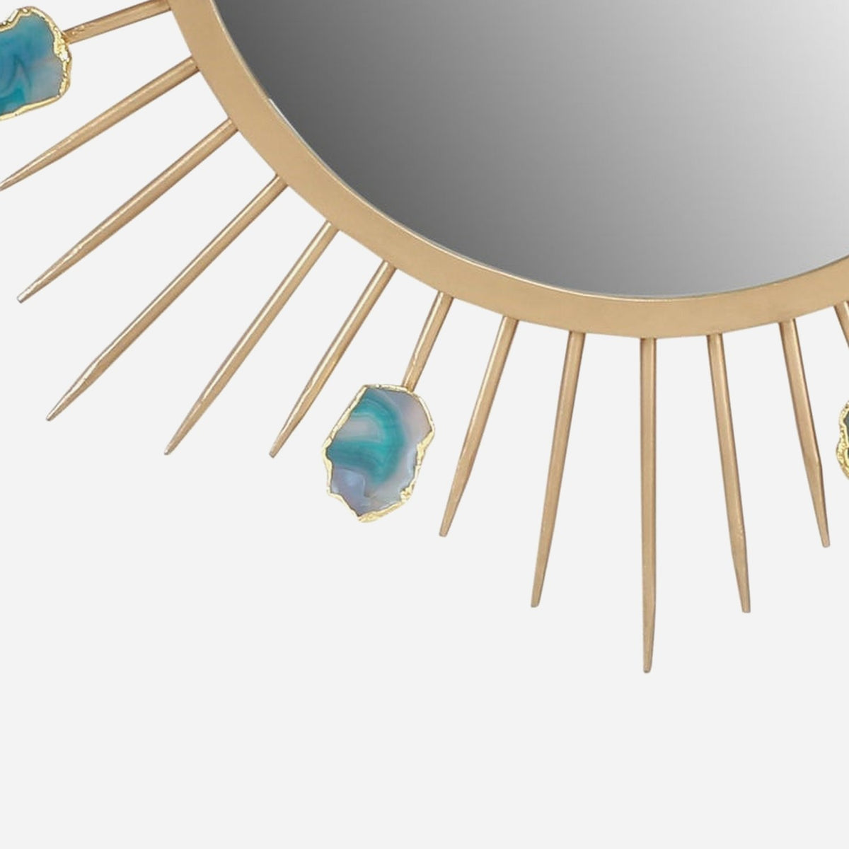 Close-up of the matte gold ring frame, mirror glass and a teal agate slice