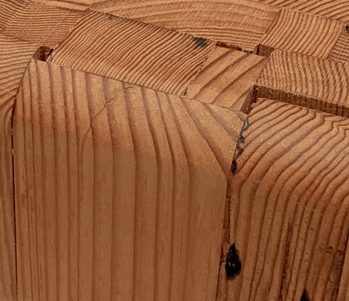 Brass hexagon leg joinery detail on the reclaimed wood side table