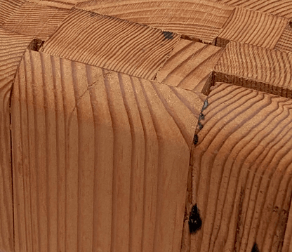 Brass hexagon leg joinery detail on the reclaimed wood side table