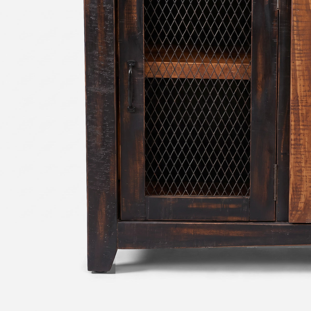 Chicken-wire end door, bar pull and square foot of the barn door TV stand (close-up detail)