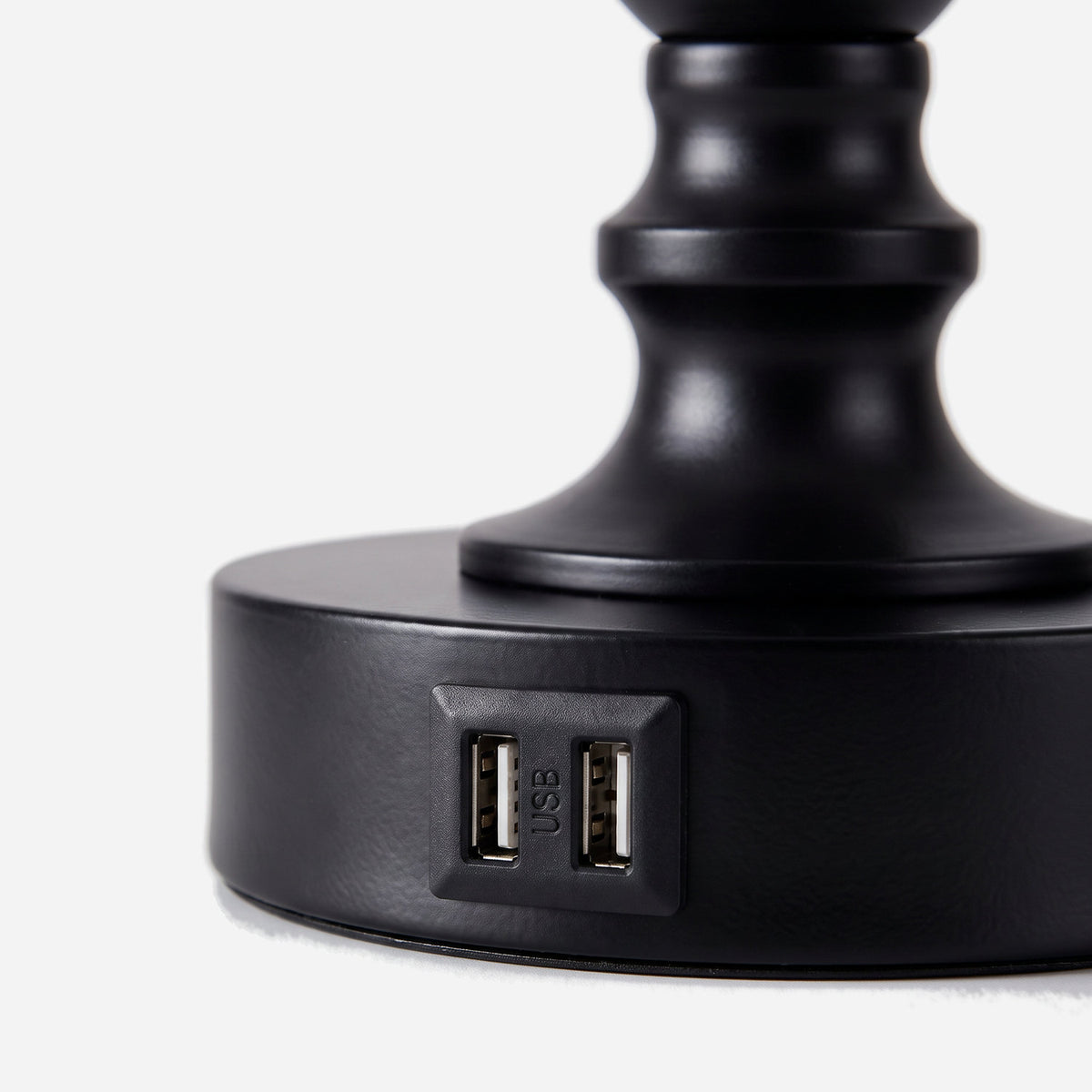 Close-up of the two USB-A ports in the black metal lamp base (close-up detail)