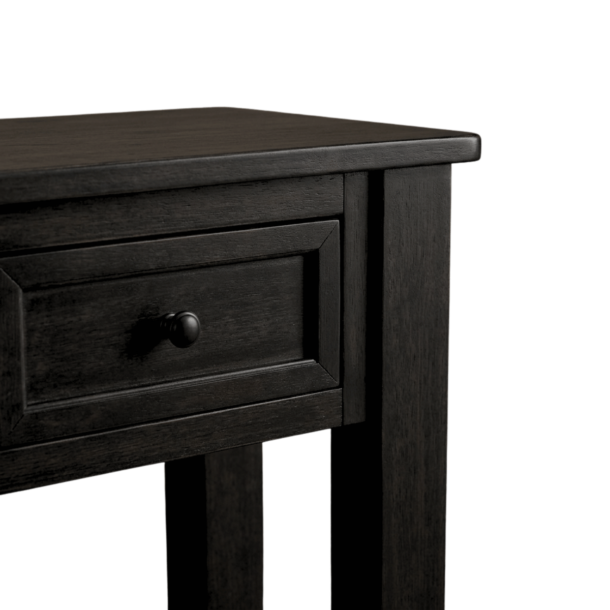 Close-up of a framed drawer front with its round black knob beside the square corner leg (close-up detail)