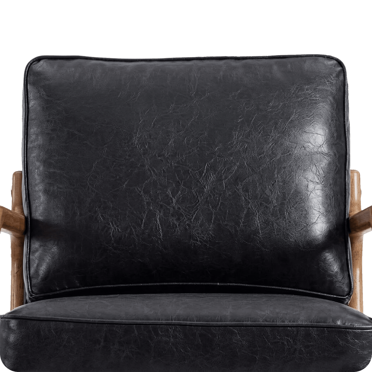 Thick black faux leather back cushion on the wood frame chair (close-up detail)