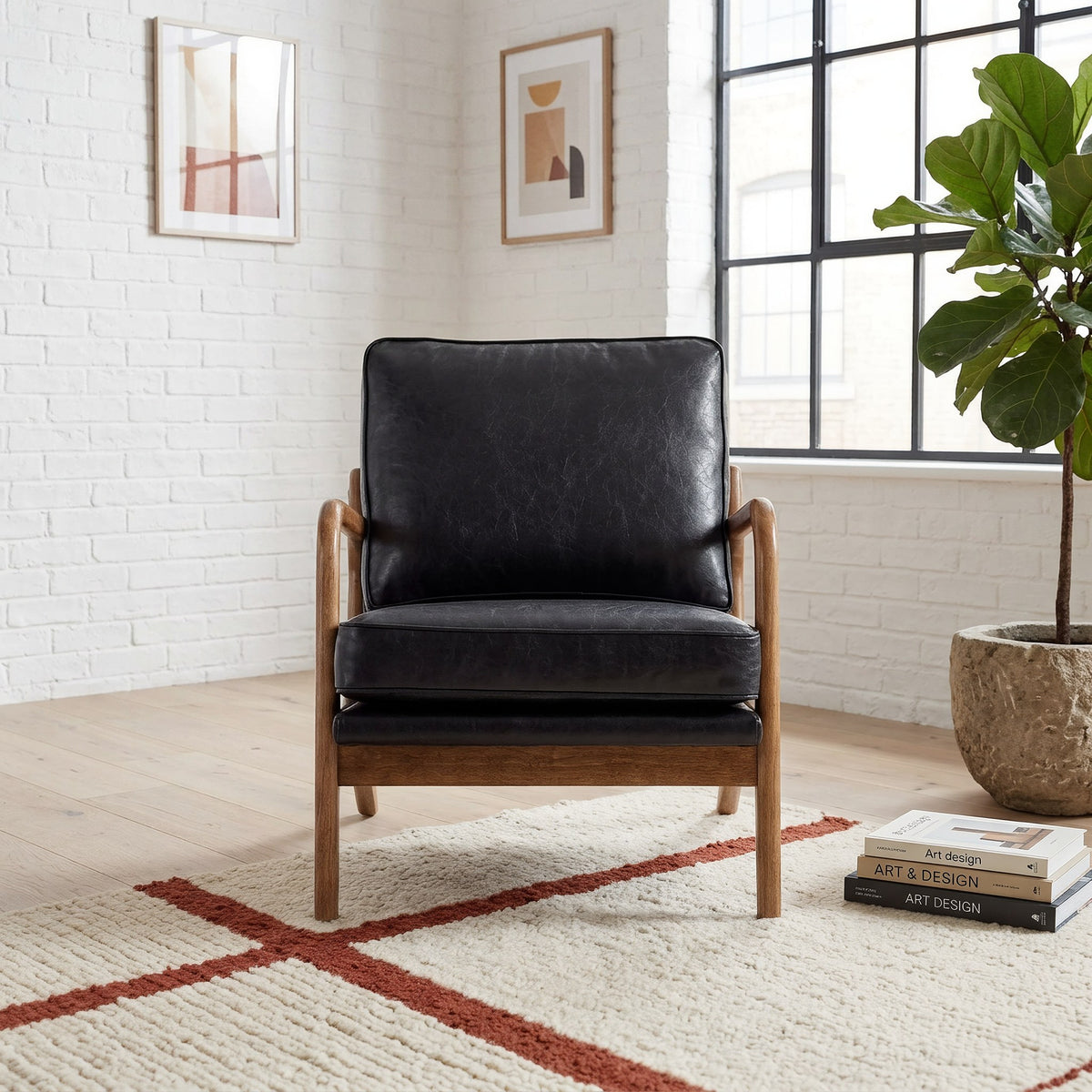 Black faux leather wood frame accent chair by a bright living room window