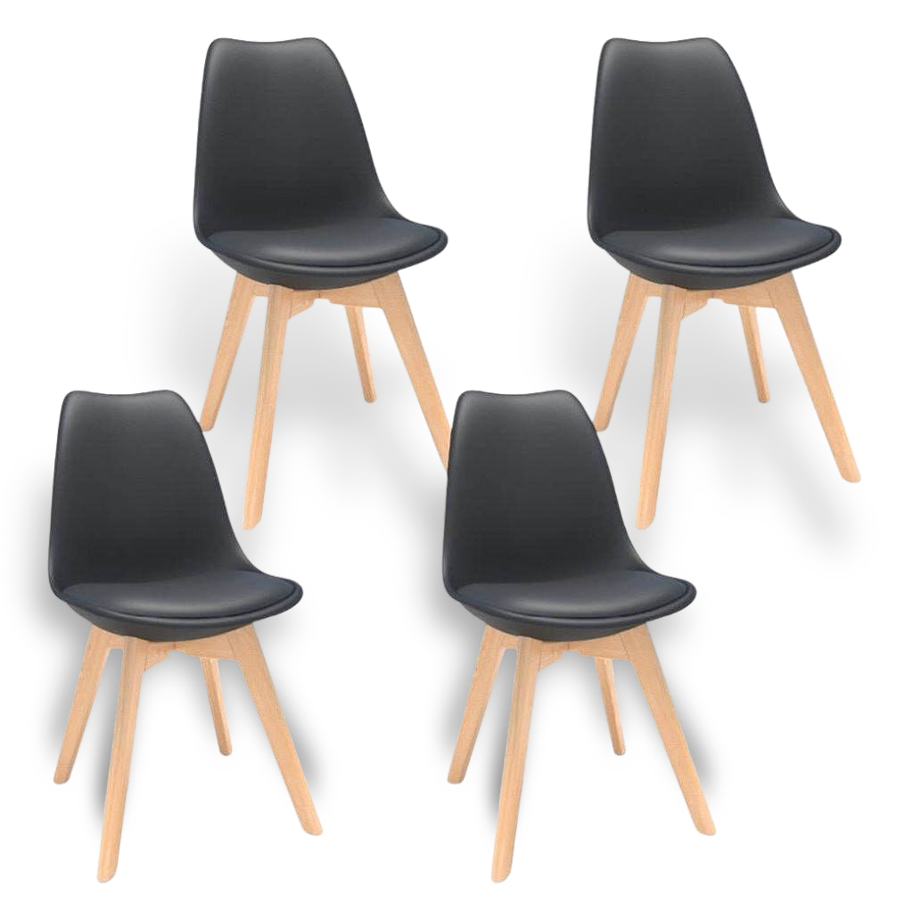 Four mid-century modern black plastic shell dining chairs with natural wood legs.