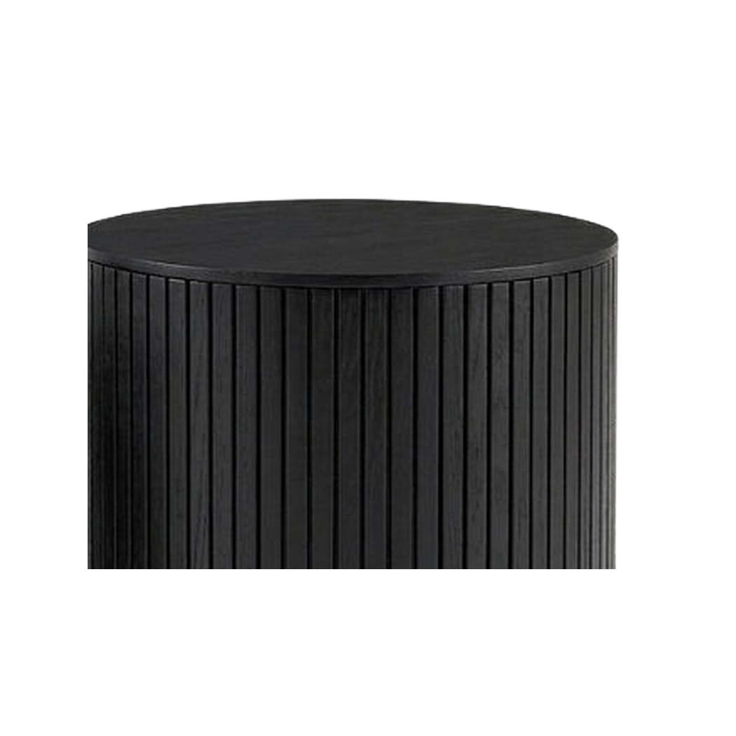 Wood grain top and fluted rib edge of the larger nesting drum (close-up detail)