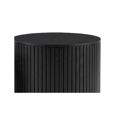 Wood grain top and fluted rib edge of the larger nesting drum (close-up detail)