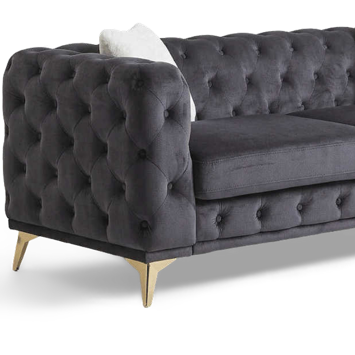 Button-tufted velvet arm and slim metal leg (close-up detail, transparent)