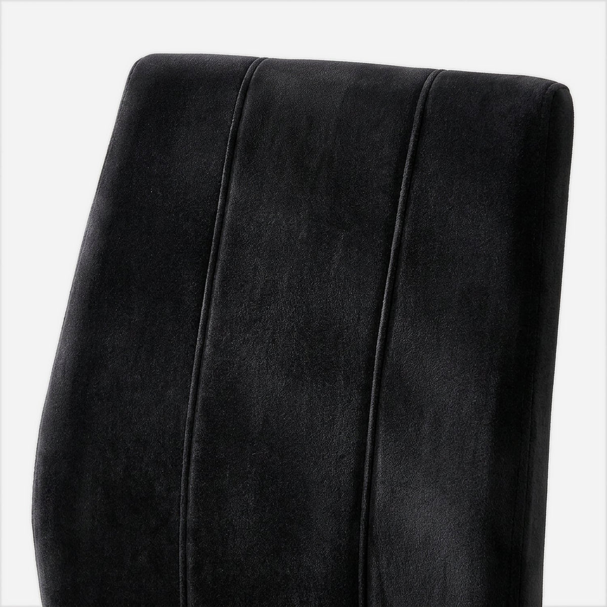 Channel stitching on a black velvet chair back (close-up detail)