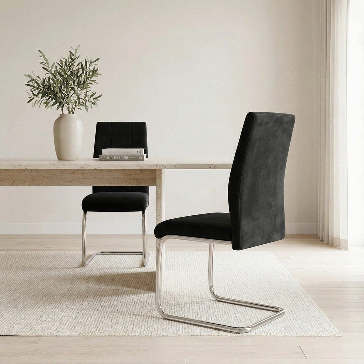Closer view of the black velvet chairs in the same dining room