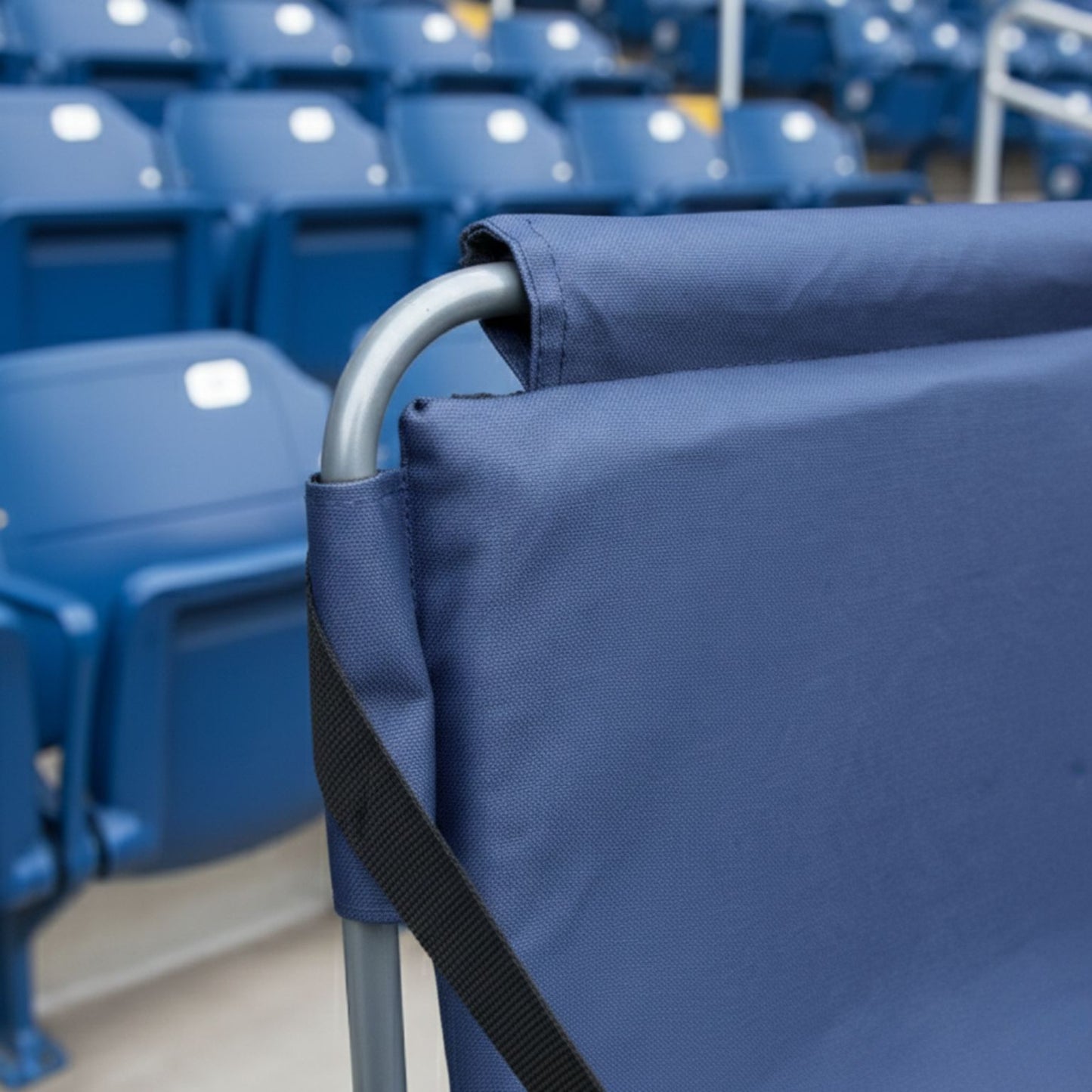 Portable blue stadium seating cushion with a folding backrest; rugged 600D polyester construction ideal for game days and outdoor bleachers.