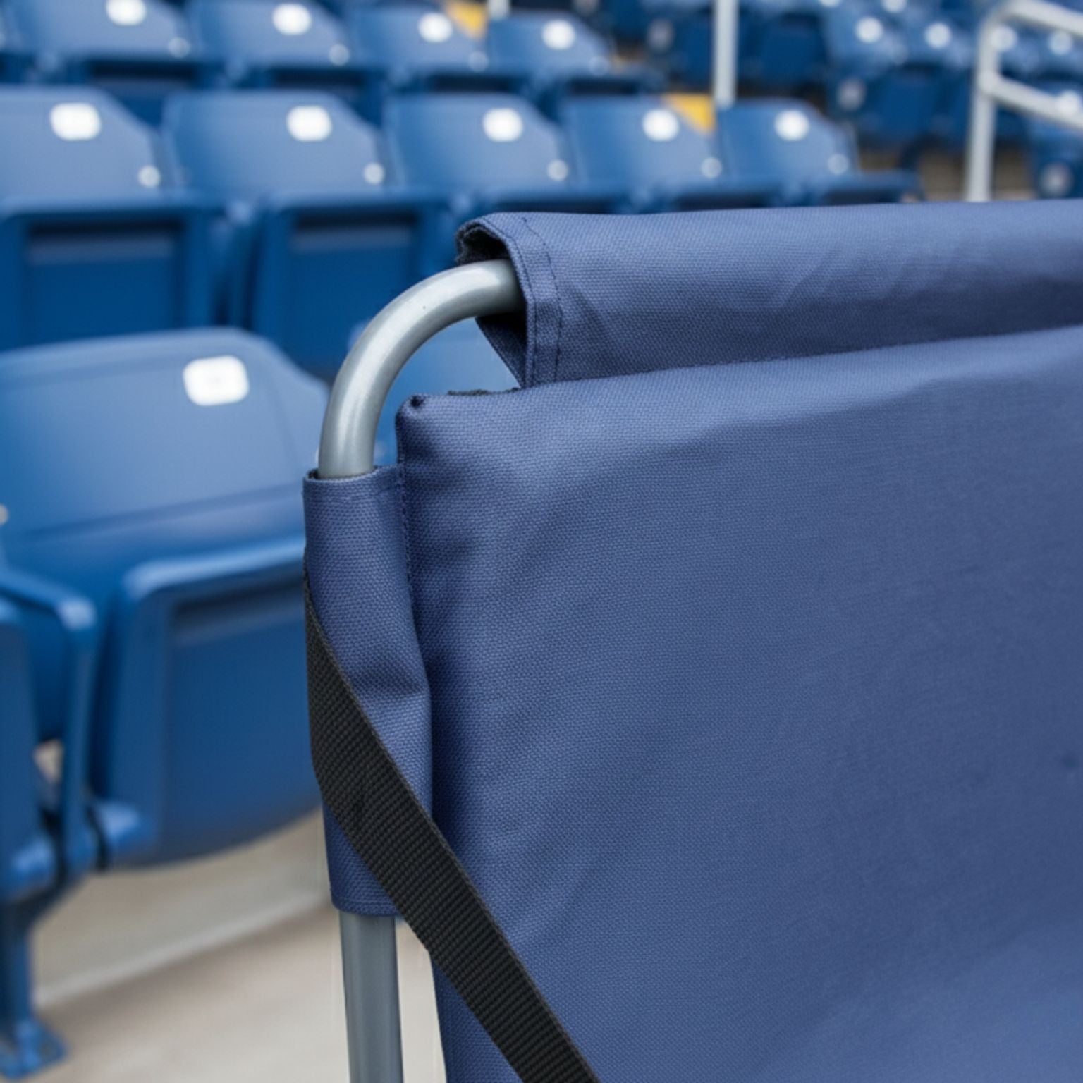Portable blue stadium seating cushion with a folding backrest; rugged 600D polyester construction ideal for game days and outdoor bleachers.
