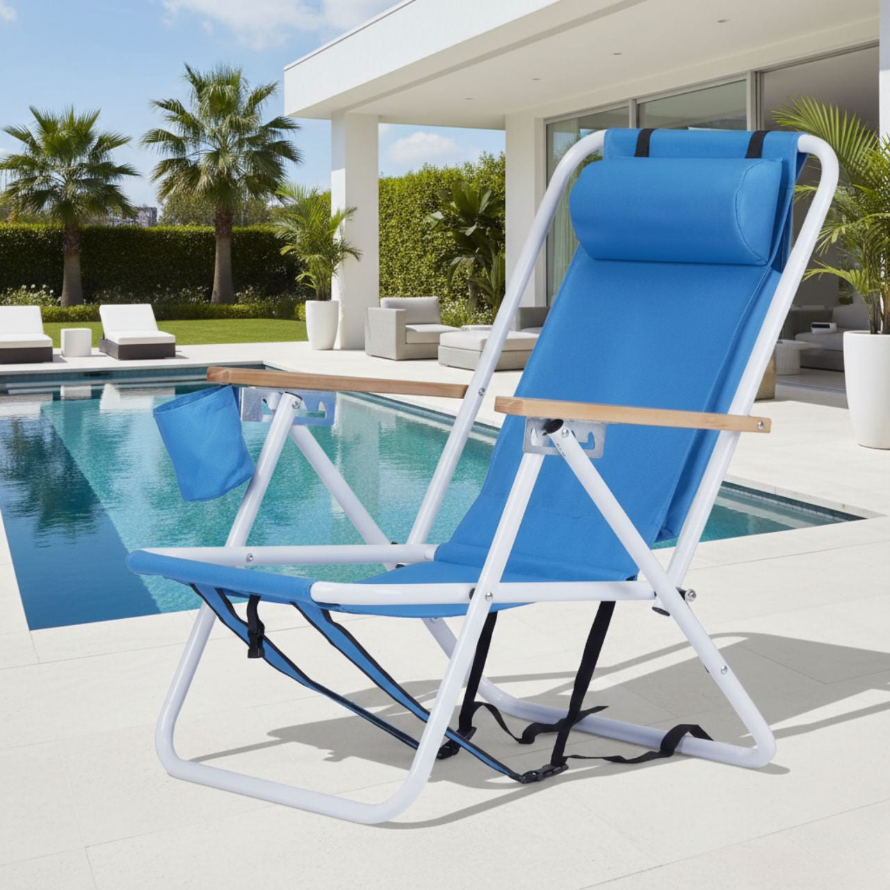 Portable high-strength beach chair with adjustable headrest in blue fabric and white iron frame by poolside.