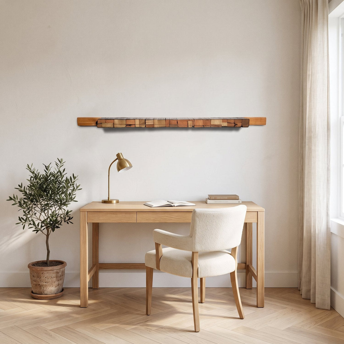 Charred wood wall art centred above an oak desk in a home study