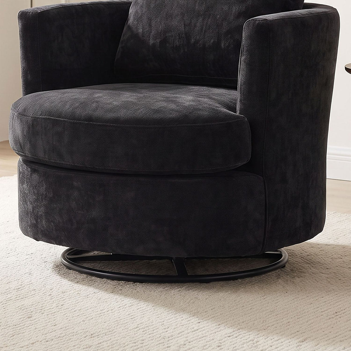 Close-up of the round black steel base that swivels a full 360 degrees