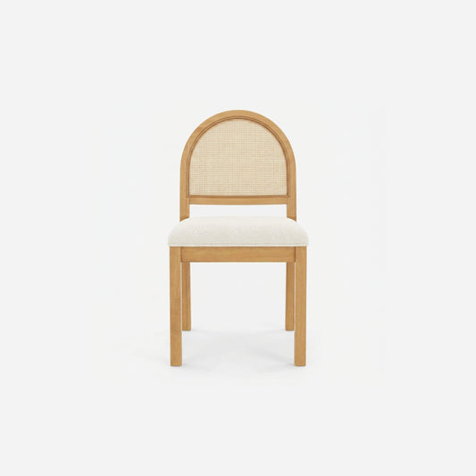 Cream boucle dining chair with an arched woven cane back and solid wood legs, front view