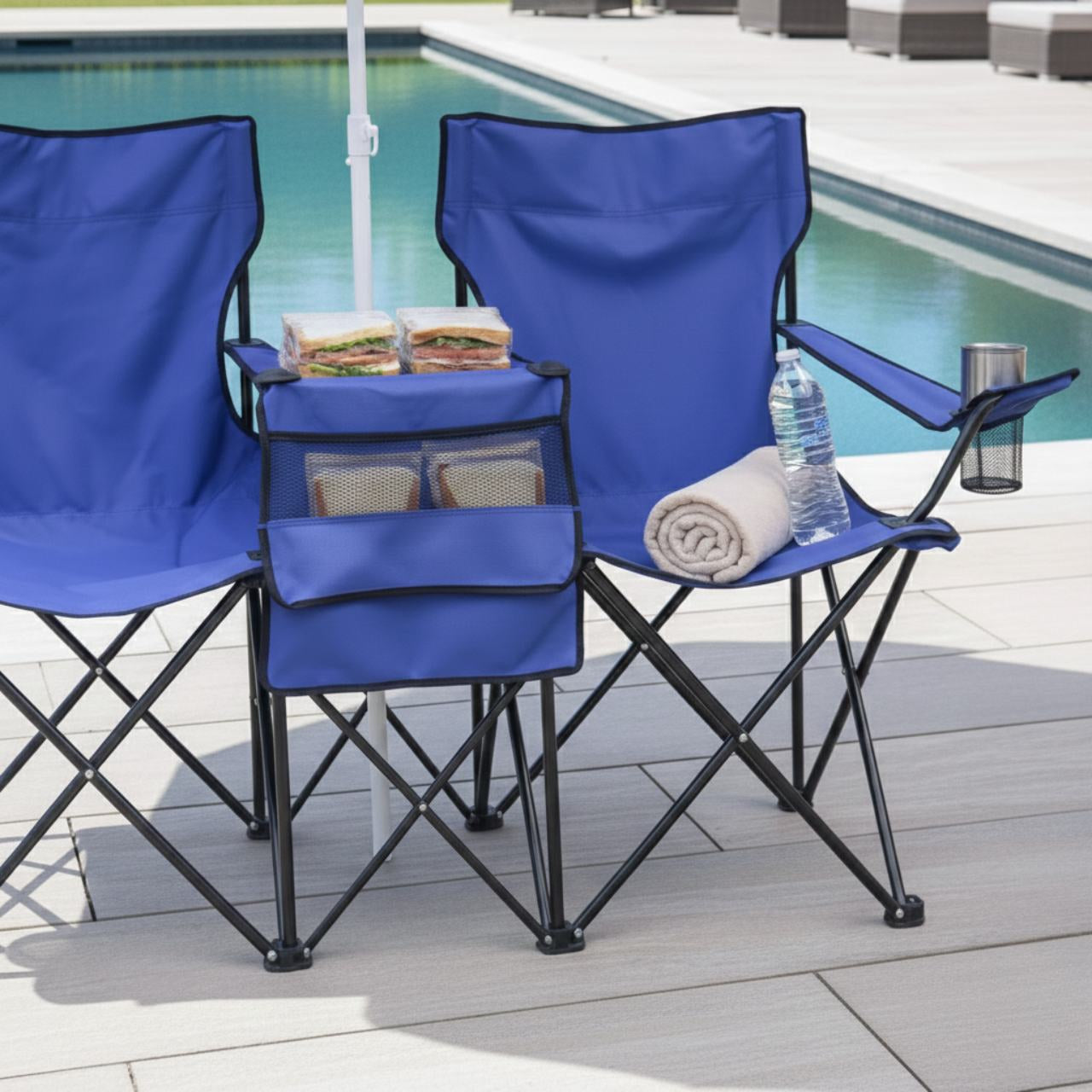 Portable blue double beach chair set with a central removable umbrella; features integrated cup holders and mesh side pockets for beach essentials.