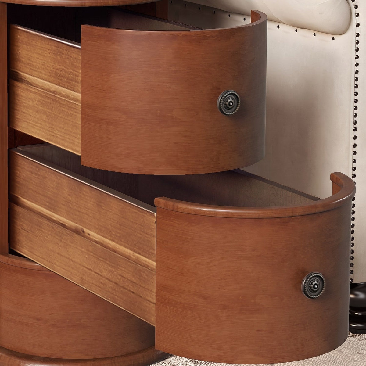 Close-up of two curved drawers with round metal pulls