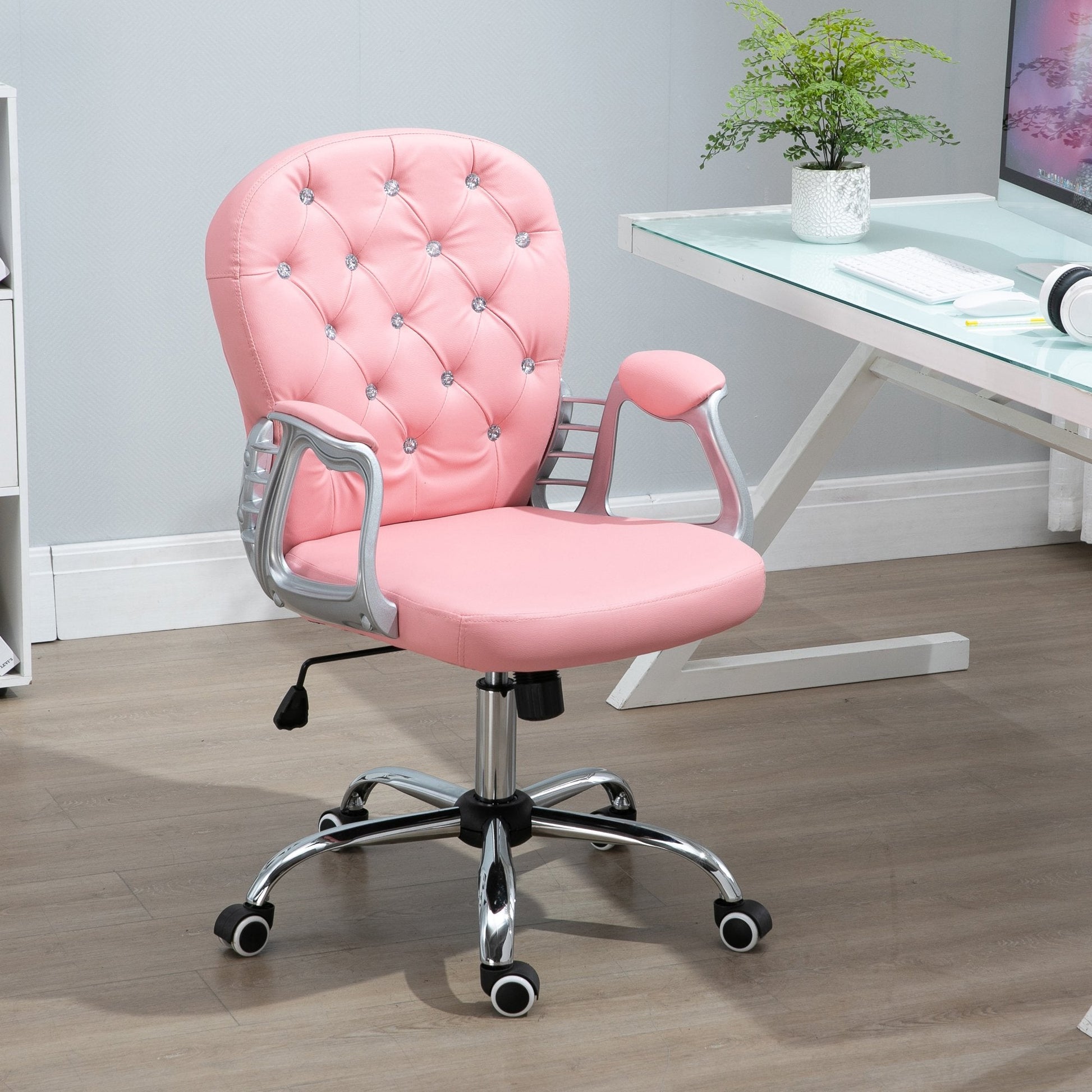 Pink Executive office chair in a room with a desk and plant