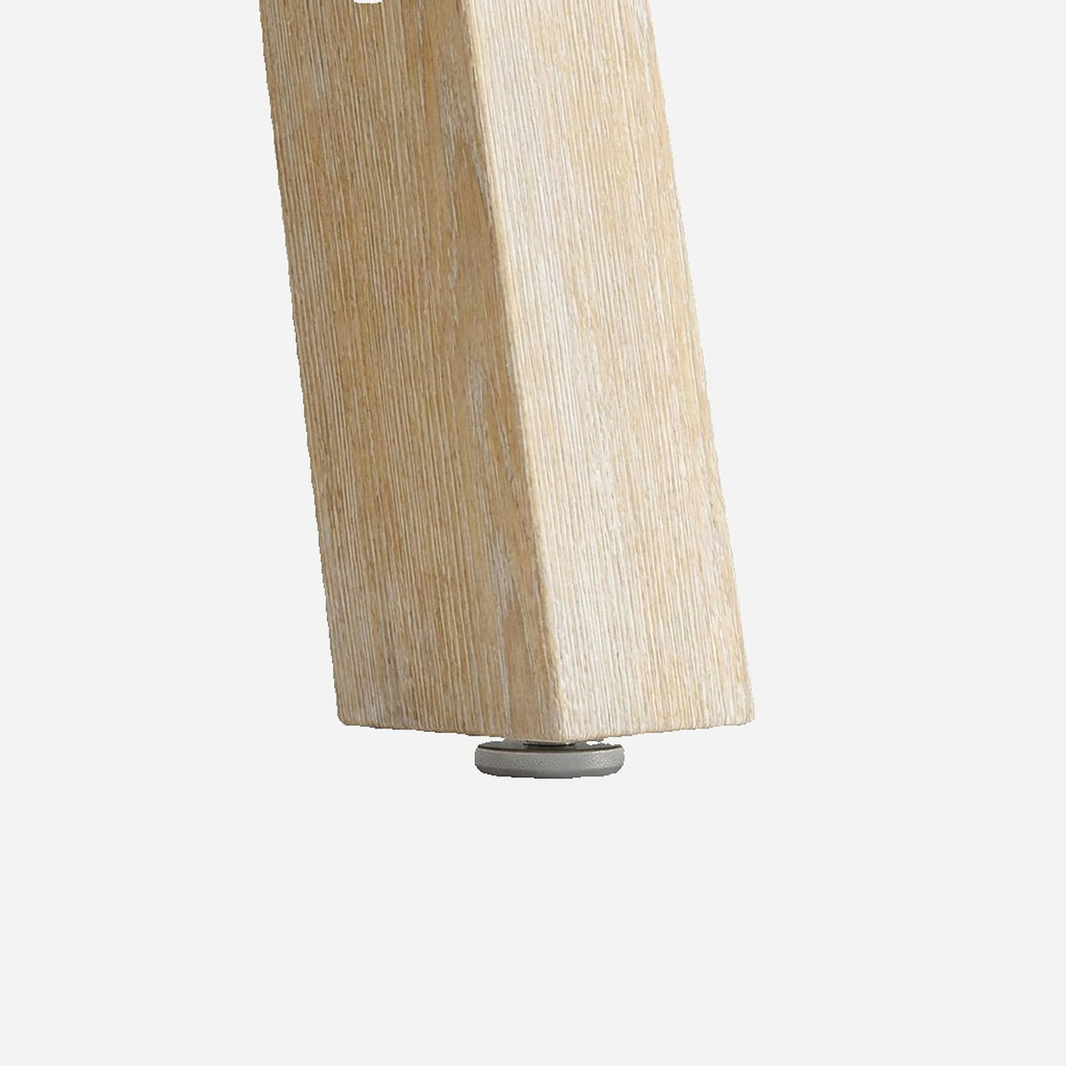 Non slip floor pad under the solid wood table leg (close-up detail)