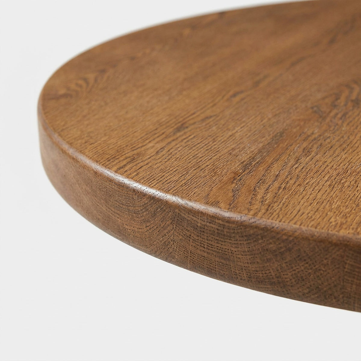 Close-up of the walnut grain and edge of the extendable dining tabletop
