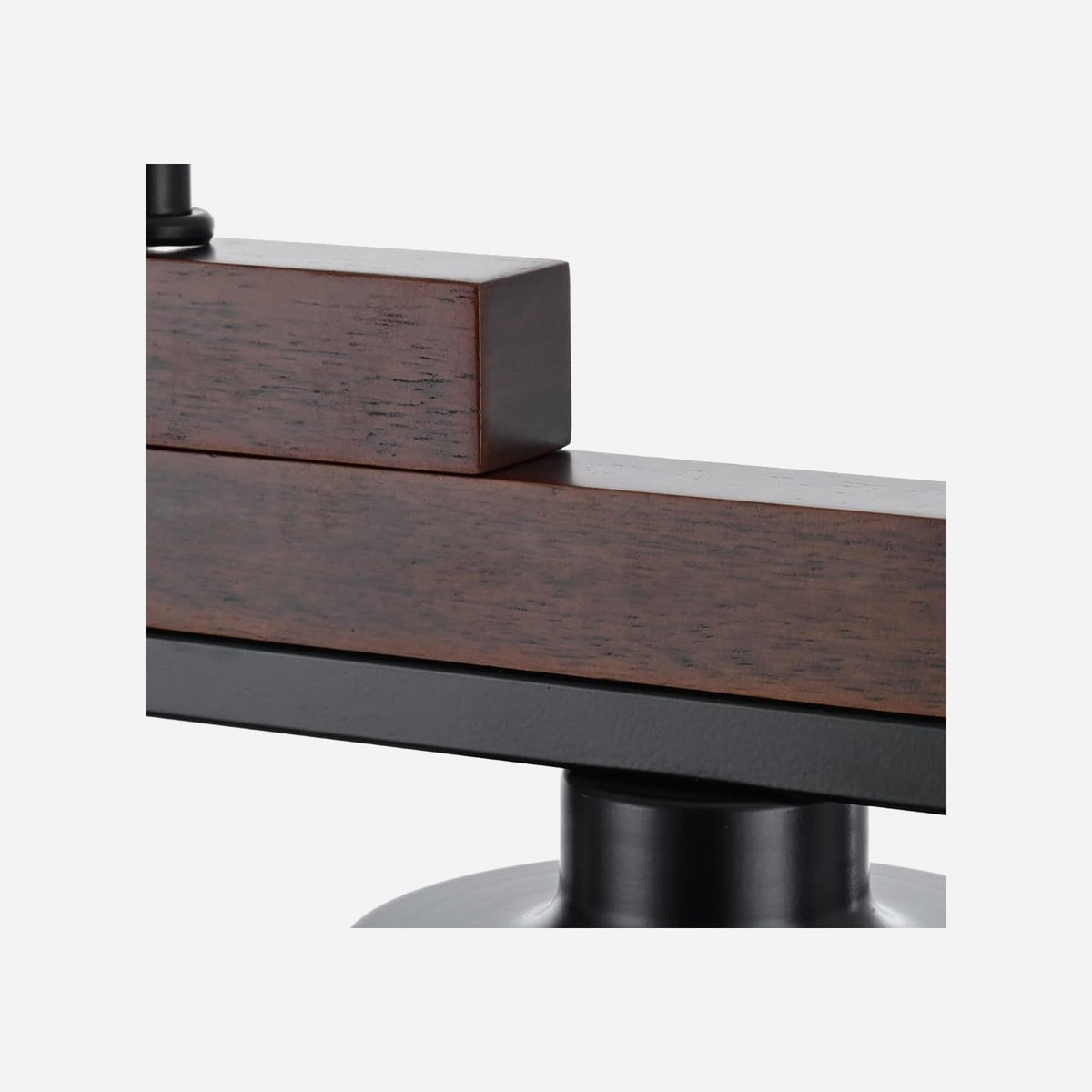 Close-up of rustic wood beam and matte black metal socket on five light farmhouse chandelier
