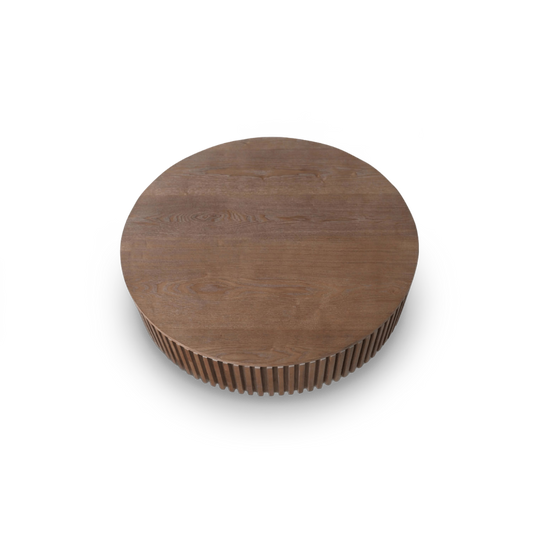 Fluted round coffee table in walnut seen from above at an angle, open-grain top and slatted band