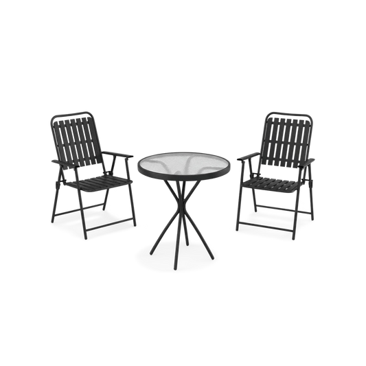 Black bistro set on a stone patio terrace with a clipped hedge behind