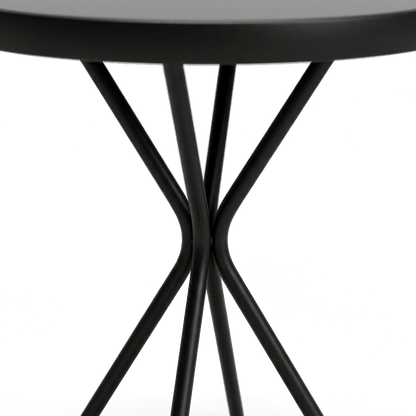 Close-up detail of the table crossed X-leg base in matte black (close-up detail)