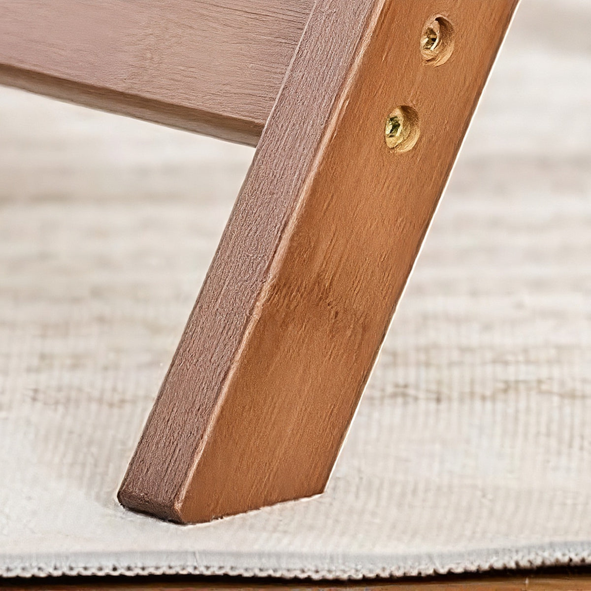 Bamboo leg and foot on a rug (close-up detail)