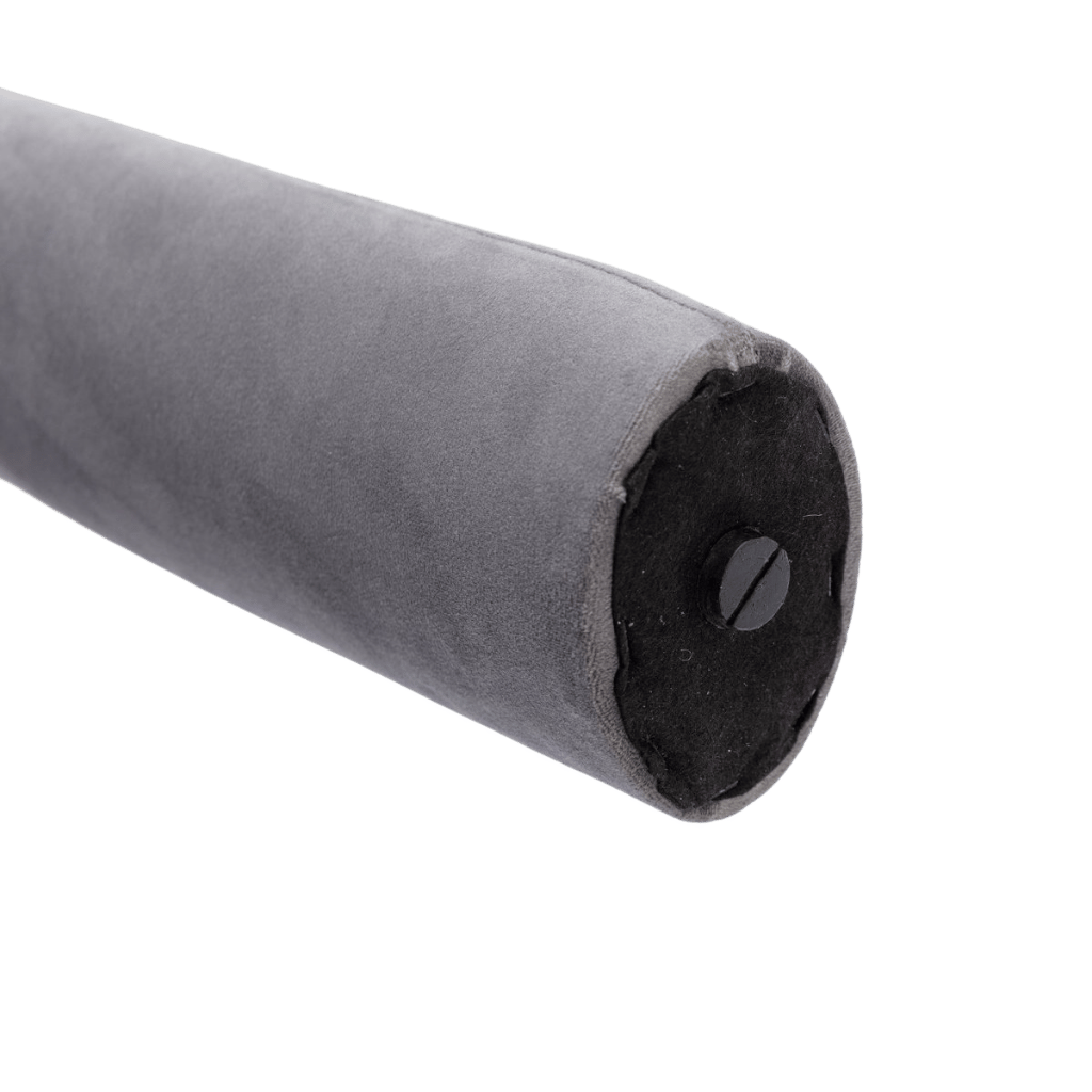 Velvet Dining Armchairs cushion with gray velvet bolster and black end cap, close-up