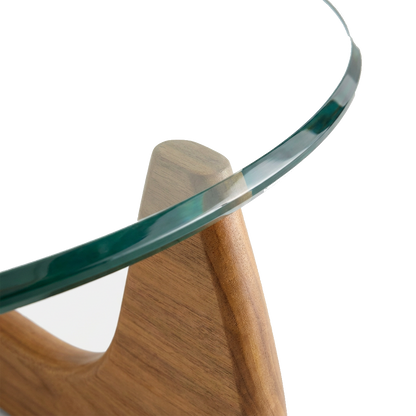 Glass top resting directly on the walnut wood base with no visible hardware